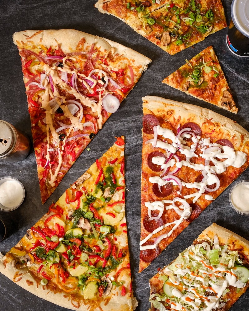 Vil du prøve Københavns største slice? 2 stk. til halv pris - hypede kæmpe-pizzaslices i Indre By